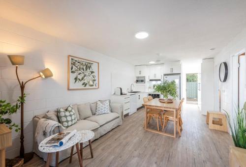 a living room with a couch and a table at Iluka Villa 1 in Iluka