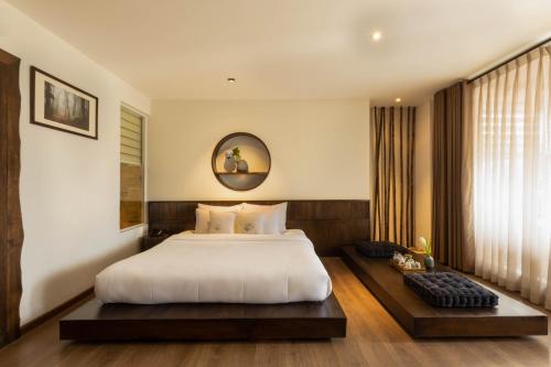 Giường trong phòng chung tại Cochin Zen Hotel