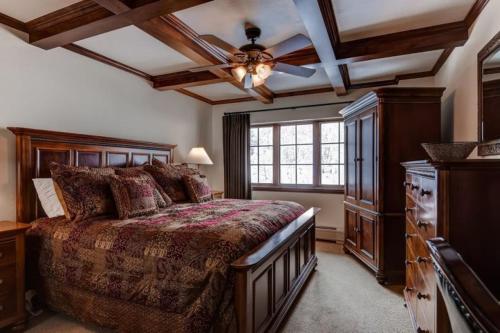 a bedroom with a large bed and a ceiling fan at Beaver Creek St James 4bedroom in Beaver Creek