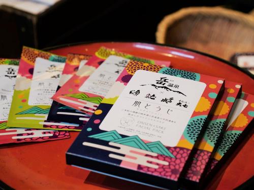 a table with cards and chopsticks on top at Hanakanzashi in Nihommatsu