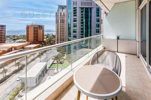 a balcony with a table and a view of the city at Botanica Tower, Dubai Marina in Dubai