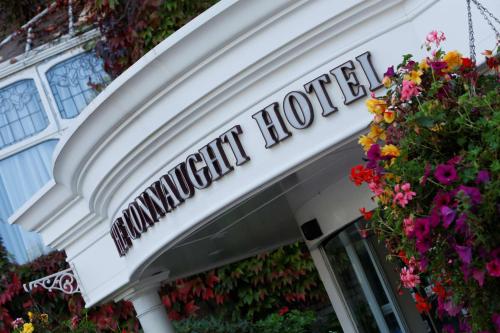 a building with a sign for aqualung hotel with flowers at Best Western Plus The Connaught Hotel and Spa in Bournemouth