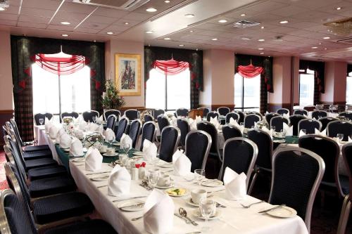 a conference room with a long table and chairs at Best Western Palace Hotel & Casino in Douglas