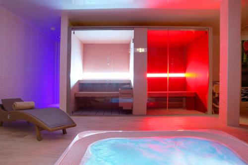 a bathroom with a jacuzzi tub in a room at Best Western Premier Le Patio des Artistes Wellness Jacuzzi in Cannes