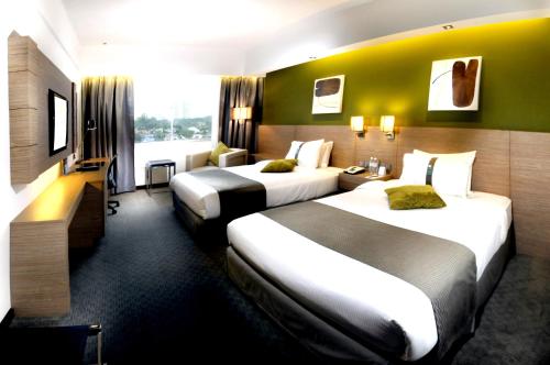 Katil atau katil-katil dalam bilik di Grand Margherita Hotel