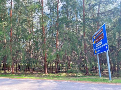 a blue street sign on the side of a road at D’Razna Inn in Kuala Terengganu