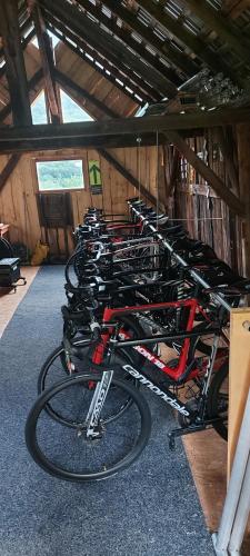 a group of bikes parked in a garage at Chambre d'hotes le cycliste in La Chapelle
