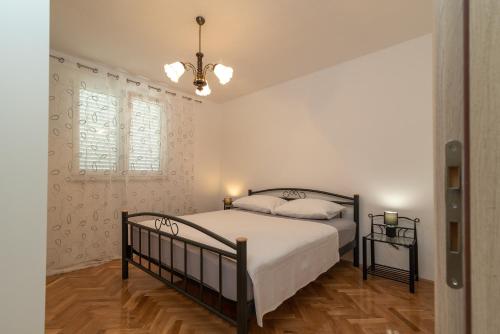Кровать или кровати в номере Apartment M&A