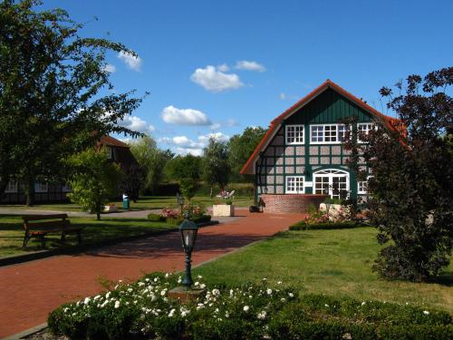 a large building with a green and white at Schloss Herrenstein in Gerswalde