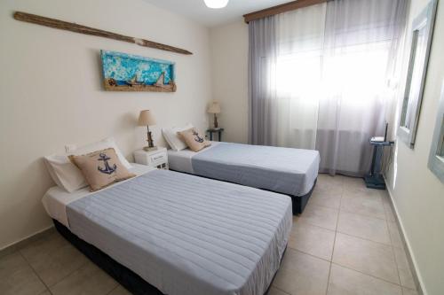 Postel nebo postele na pokoji v ubytování Ionian View Apartment