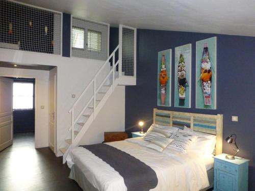a bedroom with a bed with skis on the wall at Le Clos du miroir in Courset