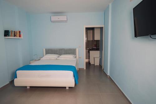 Postel nebo postele na pokoji v ubytování Vila&Apartments Kadare