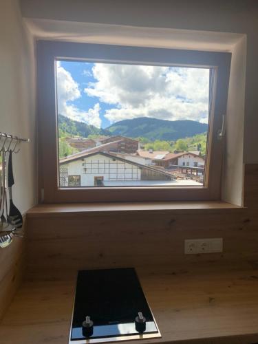 a window in a room with a keyboard in front of it at Appartement Alpenhof Wildschönau in Niederau