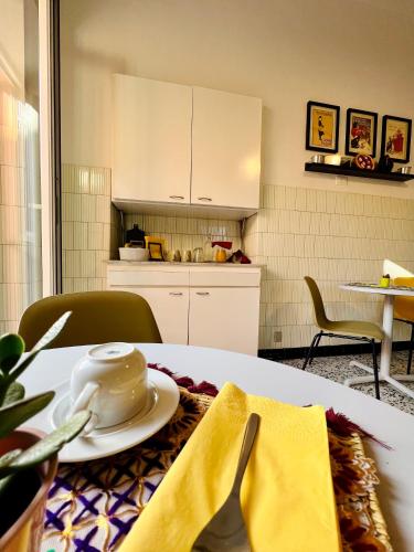 a kitchen with a table with a tea pot on it at B&B letterario Palazzo Pistocchi in Teramo