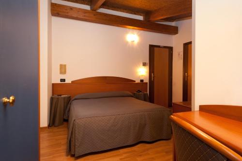 a bedroom with a bed in a room at Casa Ferretti di Ferretti Village in Silvi Marina