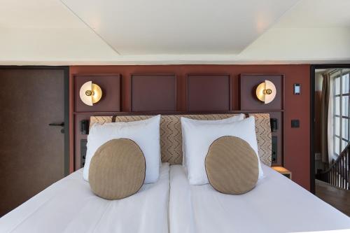 Ένα ή περισσότερα κρεβάτια σε δωμάτιο στο Hotel de Timmerfabriek I Kloeg Collection