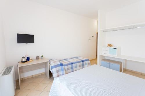 Ένα ή περισσότερα κρεβάτια σε δωμάτιο στο Borgo Levante Camere