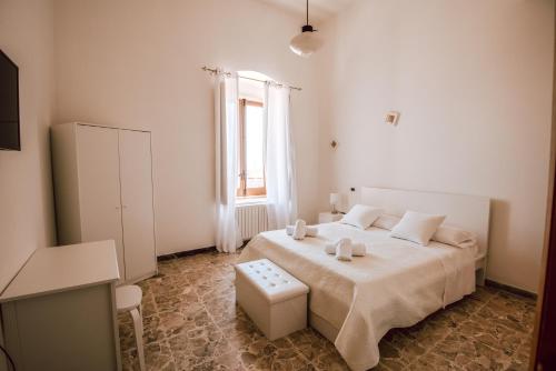 Letto o letti in una camera di Casa Museo Stephanus