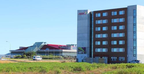 a large building with a plane on top of it at Aurora Hotel at Reykjavik-Keflavik Airport Terminal KEF in Keflavík