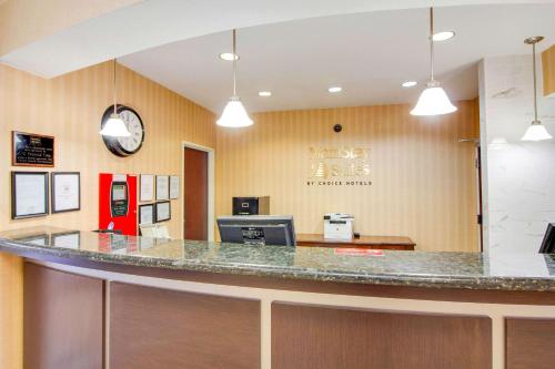 a lobby of a dental office with a counter at MainStay Suites Texas Medical Center-Reliant Park in Houston