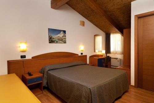 a bedroom with a large bed in a room at Casa Ferretti di Ferretti Village in Silvi Marina