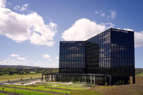 a tall black building with the words north face on it at Hyatt Place Melbourne Caribbean Park in Scoresby