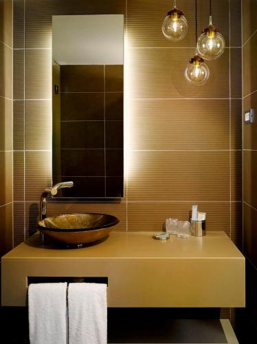 a bathroom with a sink and a mirror at INNSiDE by Meliá Prague Old Town in Prague