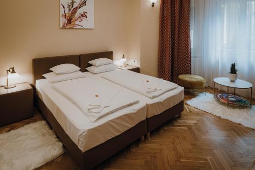Katil atau katil-katil dalam bilik di Dózsa Apartman Szeged