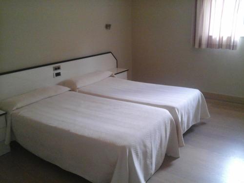 Cama o camas de una habitación en Hotel Aguadoce - Louzao