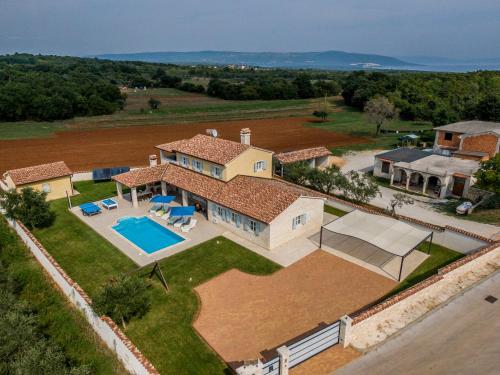 an aerial view of a house with a swimming pool at Villa Pavicini 2181 in Šegotići