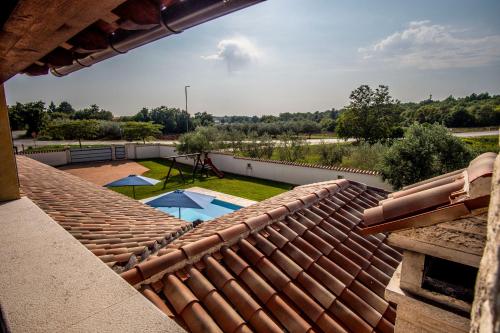 a view from the roof of a house with a swimming pool at Villa Pavicini 2181 in Šegotići