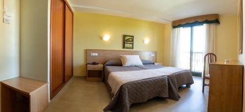 Una cama o camas en una habitación de Hotel Veiganova