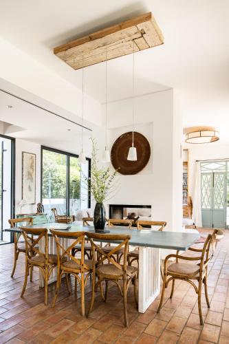 a dining room with a table and chairs at Altanure Casa Terra - Ecological Boutique Stay in Tavira
