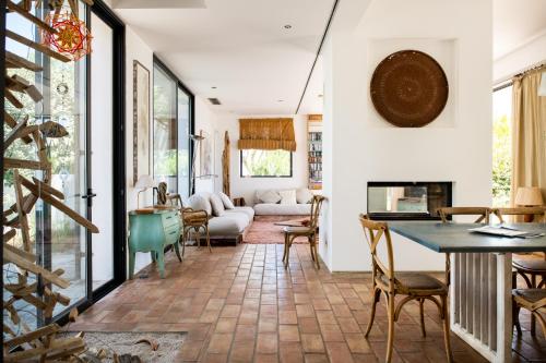 a living room with a couch and a table at Altanure Casa Terra - Ecological Boutique Stay in Tavira