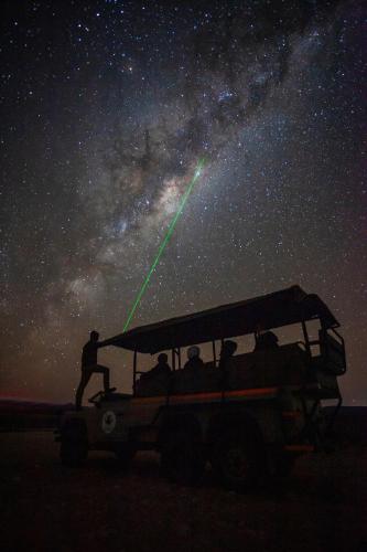 a group of people in a jeep under the stars at Inverdoorn Game Reserve Lodge in Breede River DC