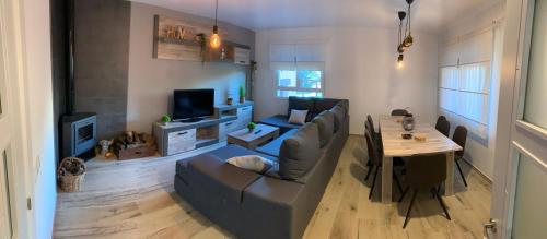 a living room with a couch and a table at El Refugio de Felix in Sotillo de la Adrada