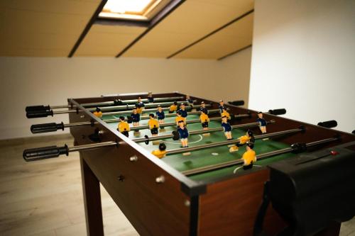 a group of toy figures on a pool table at El Refugio de Felix in Sotillo de la Adrada