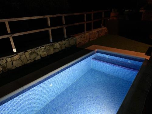 a large swimming pool in a dark room at El Refugio de Felix in Sotillo de la Adrada