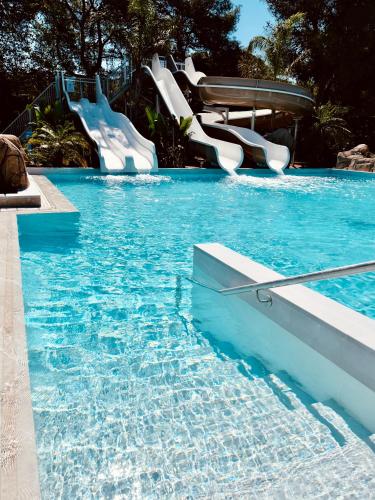 a water slide in a swimming pool at HolaCamp Sitges Garrofer in Sitges