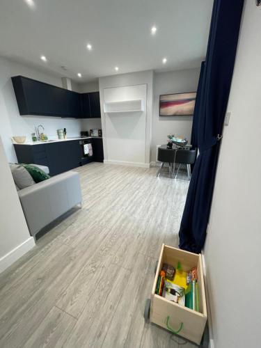 a room with a living room with a room at The Jungle Apartment - by Coastline Retreats - Jungle Themed Garden Apartment - Outdoor Bath - Next to Seafront - Childrens Toys - Superfast Wifi - Netflix - Disney in Southbourne