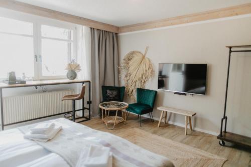 Postel nebo postele na pokoji v ubytování Peak Hotel & Event