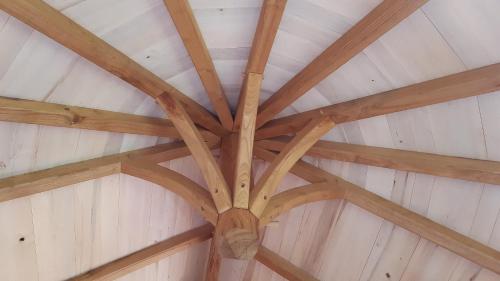 a ceiling in a barn with wooden beams at Caban'Aspe in Accous