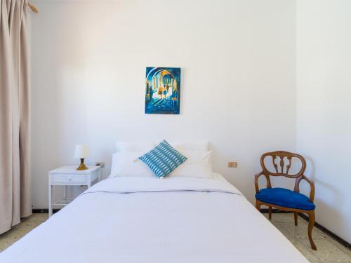 A bed or beds in a room at Agaete Pupe Home by Canariasgetaway