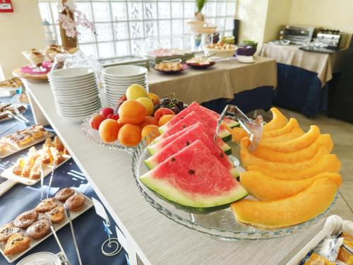 a table with a bunch of different types of fruit at Blu Star Hotel in Gabicce Mare