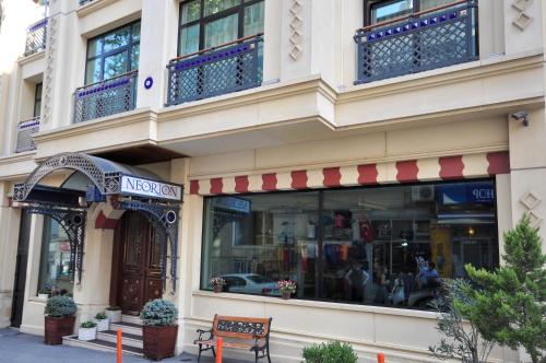a store with a bench in front of a building at Neorion Hotel - Special Class in Istanbul
