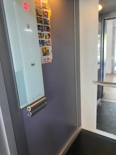 a door with a lock on it next to a window at Hill Apartment in Belgrade