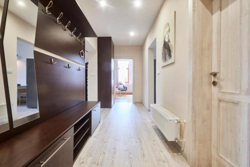 a hallway with a wooden floor in a house at Wellness Penzion U Muzea in Liberec