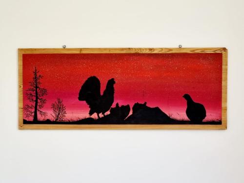 a painting of chickens against a red sunset at BMP APARTMENT EDELWEISS PASSO DEL TONALE in Passo del Tonale