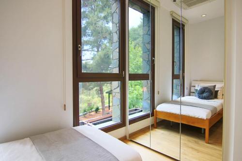 Ένα ή περισσότερα κρεβάτια σε δωμάτιο στο Phaedrus Living: Forest View Luxury Villa Chantara