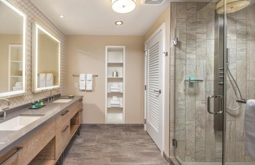 a bathroom with two sinks and a shower at Club Wyndham Clearwater Beach Resort in Clearwater Beach